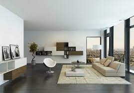 Modern minimalist living room in this design, a light gray sectional in front of the large windows and a sitting area utilizing two ivory chairs creates a conversational layout infront of the fireplace. Home July 2002