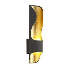 Far from being static light sources, modern interior wall lights may include movable elements which can change the direction of light, or increase and decrease light emissions in tandem with specific needs. Modern Indoor Wall Light In Two Tone Black With An Inner Gold Lining