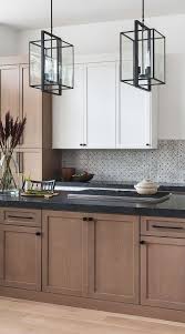 Gold accents including the brass faucet and cabinet hardware bring the bling. 50 Black Countertop Backsplash Ideas Tile Designs Tips Advice Black Kitchen Countertops Modern Kitchen Cabinets Kitchen Cabinet Design