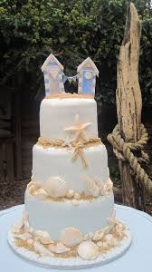 Our Beach Themed Sea Shell Cake With Beach Hut Topper Seaside Wedding Cake Beach Wedding Cake Beach Theme Wedding Cakes