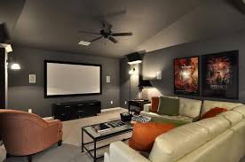 I Like The Gray Walls In This Media Room With The Pop Of Orange For Color Media Room Colors Home Theater Room Design Small Media Rooms