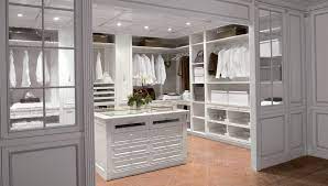 Multiple levels of hanging rods add height to. Master Bedroom Closet Design Ideas