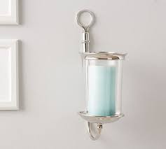 Add a dynamic touch to your decor with this unique scroll shape with hand assembled cristals and a candle plate. Arlington Nickel Wall Mounted Hurricane Wall Candle Holders Wall Mounted Candle Holders Glass Hurricane Candle Holder