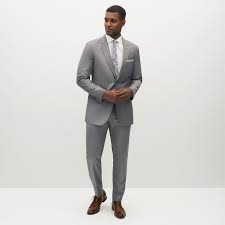 With so many different styles of wedding suits to choose from, this versatile outfit can easily be worn to your engagement party, rehearsal dinner, afterparty, and for a suit that catches the light just right, reach for this satin duo. Men S Light Grey Suit Suitshop