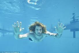 Nirvana's nevermind has one of the most famous album covers of all time: Nirvana S Nevermind Album Baby Recreates Iconic Photo 25 Years Later Daily Mail Online