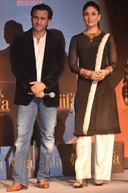 Dressed in a loose summer outfit, a full sleeve blue shirt paired with a pair of white palazzo. 48 Pictures That Give A Complete Timeline Of Kareena Kapoor Khan And Saif Ali Khan S Relationship Vogue India