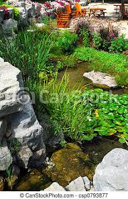 Resting seal cast stone garden pond spitter. Patio And Pond Landscaping Natural Stone Pond And Patio Landscaping With Aquatic Plants Canstock