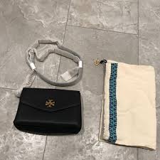 Get free shipping on designer shoes, handbags, clothing & more of this season's latest styles from designer tory burch. Tory Burch Bags Black Tory Burch Kira Mixed Materials Mini Bag Poshmark