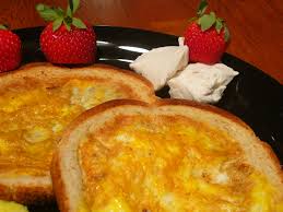 Place the bread, along with the cut out, into a skillet over medium heat and let it toast for a minute or two until it gets pleasantly golden. Collegiate Meals Pretner S Mom Toad In The Hole Egg In A Blanket Egg In Toast 3 Steps With Pictures Instructables