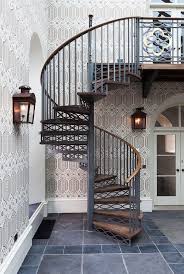 Space Saving Spiral Staircase With A Backdrop Draped In Wallpaper Traditional Staircase Staircase Outdoor Stairs Design