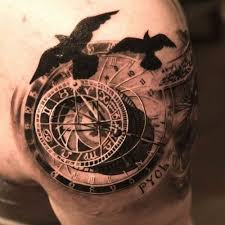 A compass lies in the middle of a map and below a rope. 160 Meaningful Compass Tattoos Ultimate Guide July 2021