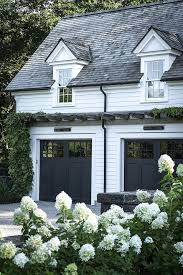 Black And White House Exterior Paint Black Garage Doors Love The Matte Paint Vs Reflective Windows On An Otherwise Plain White House House Exterior Black Garage Doors Farmhouse Exterior