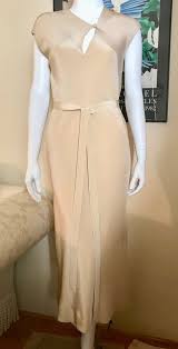 1970s halston tan sand ultra suede sleeveless vintage 70s shirt dress halston black embellished silk blouse evening wear montaldo's 1970s size m vintage 1977 halston couture beaded pastel floral silk blouse and kimono jacket 1970s halston black silk chiffon wrap dress Iconic 1970s Halston Saks 5th Ave Bias Cut Champagne Gem