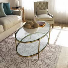 As styles comes and go, it adapts and keeps its position in the spatial configuration before you start looking for a glass top coffee table, it's important to take some time to consider the advantages as well as the disadvantages that come with it. Boyel Living 47 In Gold Large Oval Glass Coffee Table With Storage Shelf Wf Ct 1353c The Home Depot