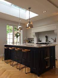 Pair with patterned kitchen flooring, pendant lights and a white quartz worktop for a high end kitchen look. Neptune Chichester Kitchen With Navy Blue Island French Oak Solid Wood Parquet Flooring French Parquet Flooring Kitchen Kitchen Island Oak Dark Blue Kitchens