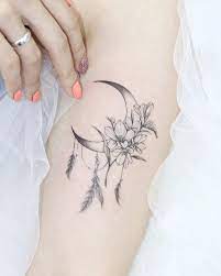 The Coolest Crescent Moon Tattoos And What They Mean In 2021 Girly Tattoos Tattoos Neck Tattoos Women