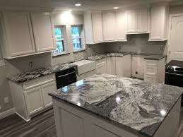 Emerald pearl granite countertops look great with both white and dark cabinets. Granite Installers Near Me