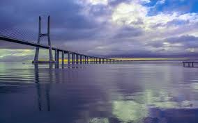 The entire construction of the vasco da gama bridge was split into seven sections including the sacavem and en10 variant interchanges, the north. Vasco Da Gama Bridge Portugal Visitor Travel Guide To Portugal