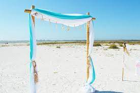 Turquoise Beach Wedding Arbor Starfish On An Arbor All Inclusive Beach Wedding Packages Florida Beach We Bamboo Wedding Arch Wedding Arch Beach Wedding Arch