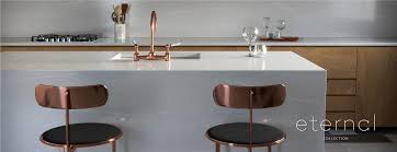 This slab features a light color with light gray veins and splotches of shine and color. Silestone Eternal Collection