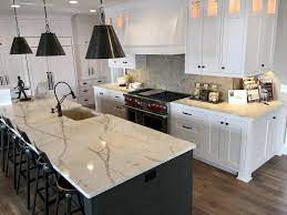 Im not keen on a wooden floor and worktop tbh, we've got a dark grey tiled floor and we are goin to have a warm. Add Boldness To Your Kitchen With Corian Quartz Calacatta Natura Marble Top Kitchen Island Kitchen Island Design White Kitchen Decor