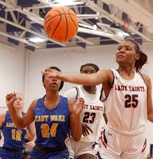 Saints' girls survive lethargic effort, turnovers
