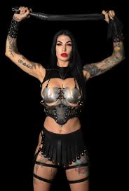 Mistress Damazonia's seductive pose revealing her height