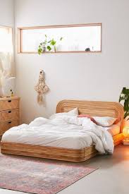 The rattan headboard is wrapped with rawhide bindings to add beautiful contrast and strength. Ria Rattan Bed Urban Outfitters