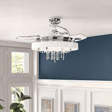 This crystal chandelier is paired with a ceiling fan. Chandelier Ceiling Fan Combo Wayfair