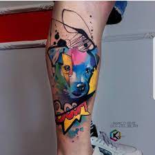 Watercolor tattoo of a puppy inked on the left thigh. Watercolor Tattoos