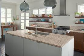 The stunning kitchen layout with giallo ornamental granite counters and a beautiful dark cherry cabinet. Giallo Ornamental Granite Granite Countertops Granite Tile