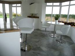 Doris P Dining Chairs And Matching Barstools In White Leather An Open Plan Kitchen Dining Area Near Yo Adjustable Bar Stools Bar Stools Breakfast Bar Stools