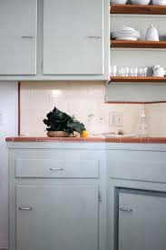 This neutral, versatile color has so many different shades, it's easy to create a kitchen design you're sure to love for a lifetime. Http Www Designsponge Com Kitchen Inspirations Green Kitchen Cabinets Light Gray Cabinets