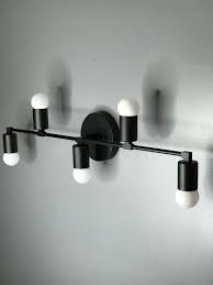 Excited To Share This Item From My Etsy Shop Bristleback Wall Sconce Matte Black 5 Bulb Vanity Light Fixture Bathroom Lighting Sconces Vanity Light Fixtures Keeping your bathroom modern and vibrant is no easy feat, but luckily, whether you have a large or small bathroom, here are a few easy bathroom trends that will help keep your bathroom looking so consider matte black if you want to give your bathroom a modern look that won't easily be forgotten.