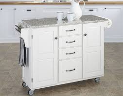white kitchen island with granite top