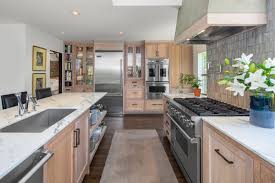 This preliminary space acknowledges the ingrained design inclination of the office. A Stucco Hood Stands Out In A Functional Seattle Kitchen By Erin Carlyle Houzz Viking Range Llc