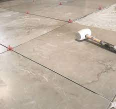 Laying floor tiles on concrete basement. How To Tile An Uneven Floor A Step By Step Guide Atlas Ceramics
