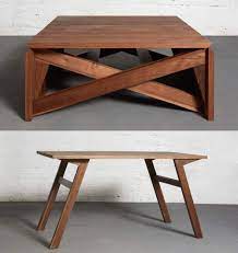 The beautifully crafted dining table converts to a generously sized coffee table with two simple and ergonomic movements. Transforming Coffee Table Mk1 From Duffy London