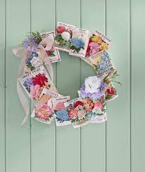 Wrap the styrofoam wreaths in rope and then install the clothesline in front using clothespin and twine and make outstanding summer wreaths get inspired of the given sample that has been adorned with custom cardboard letters and also with faux colorful flowers! 30 Diy Spring Wreaths How To Make A Spring Wreath Yourself