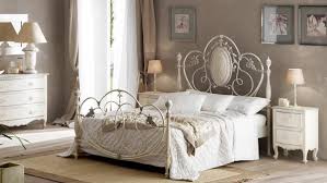 Can you hear a harpsichord providing some romantic background this wrought iron canopy bed is shown with an exquisite wrought iron chandelier. Stylish And Original Iron Bed Frames For A Chic Interior In The Bedroom