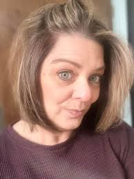 Where can I get my black hair stripped to achieve silver hair?