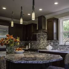 Countertops in warm, dark grays keep the monochromatic scheme from feeling cold. 5 Popular Granite Kitchen Countertop And Backsplash Pairings