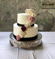 Simple Smooth Iced Buttercream Wedding Cake Garnished With Black Ribbon Custom Cake Topper And W Wedding Cake Ribbon Custom Cake Toppers Simple Wedding Cake