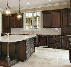 Check out how intense the contrast of black cabinets with a white backsplash is in this look reinforced with gallery space! Pin On Kitchen