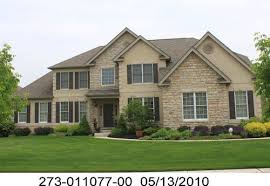 Cute house with a lighter blue stucco color used (akconstructionent.com). What Color Shutters For French Country Look On Stucco Stone House