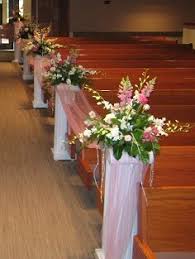 In some traditions, one or more children carry bouquets or drop flower petals in front of the bride in the wedding procession. Wedding Aisle Flowers Ceremony Arrangements In Gretna Ne Town Country Floral