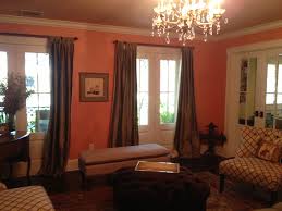 Salmon Walls Graphic Print Chairs And Dark Gray Green Curtains And Sofa