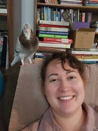 Here are some selfies I took with Sandy, my pet pigeon. 🧡 -Ivy