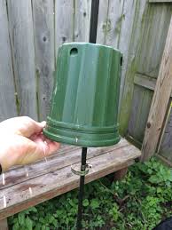 How to make your own squirrel baffle. Chipmunk Baffle For Bird Feeder Pole Made From Reused Empty Plant Pot And Hose Clamp Works G Squirrel Proof Bird Feeders Bird Feeder Poles Bird Feeder Baffle