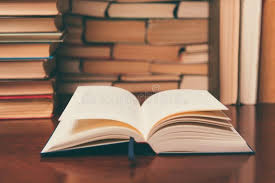 Book On The Table Against The Background Of Books Open Book On The Table On Th Sponsored Background Table Book Book O Open Book Books Background